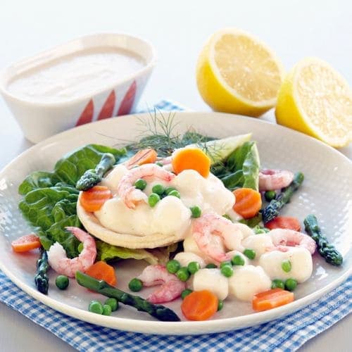Terteskjell med fiskepudding i hvit saus